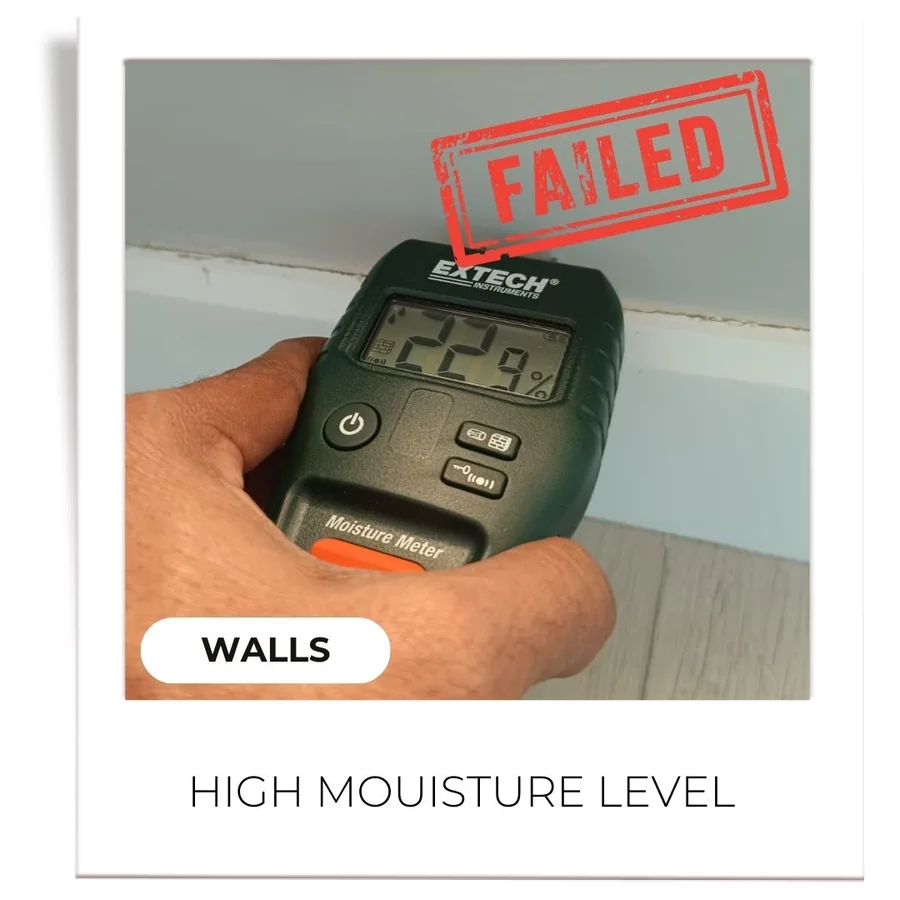 Annotated inspection photograph: High moisture in a wall
